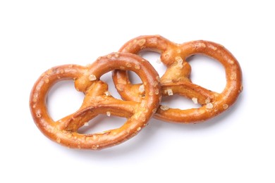 Photo of Two delicious pretzel crackers isolated on white, top view