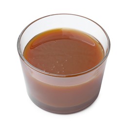 Photo of Tasty caramel sauce in glass bowl isolated on white