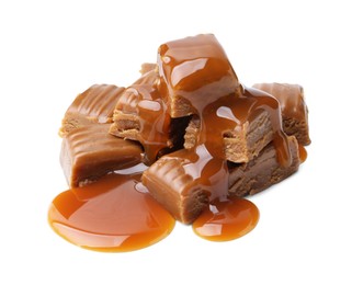 Photo of Tasty candies with caramel sauce isolated on white