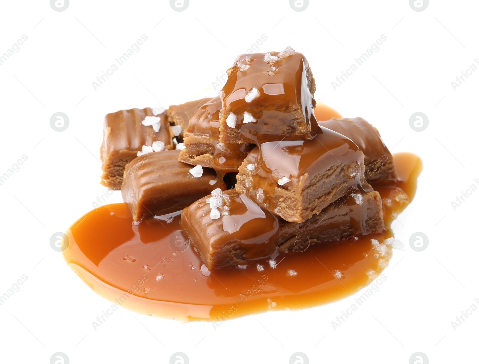 Photo of Tasty candies with salted caramel isolated on white