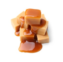 Photo of Tasty candies with caramel sauce isolated on white