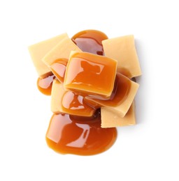 Photo of Tasty candies with caramel sauce isolated on white, top view