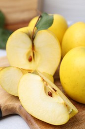 Fresh ripe yellow apples on table, closeup