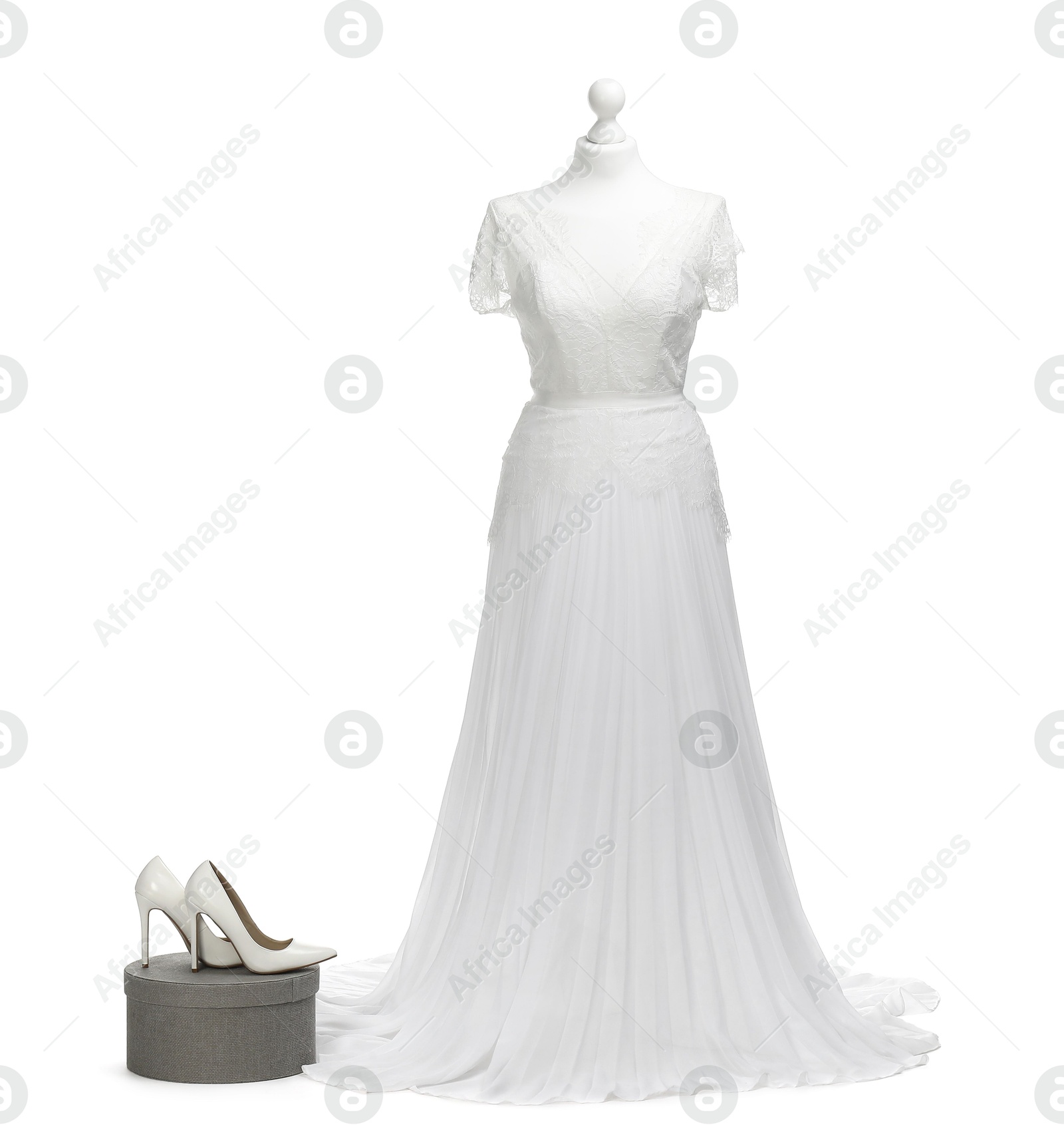 Photo of Mannequin with beautiful wedding dress and shoes isolated on white