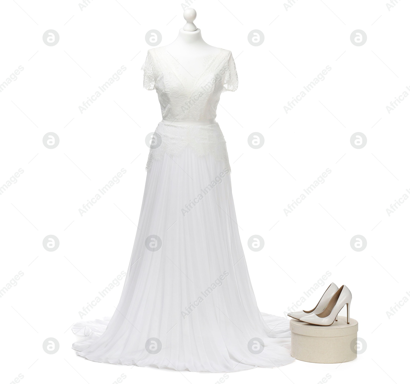 Photo of Mannequin with beautiful wedding dress and shoes isolated on white