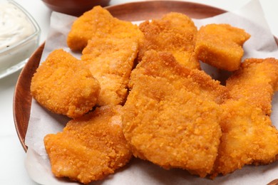 Photo of Tasty chicken nuggets on table, closeup view