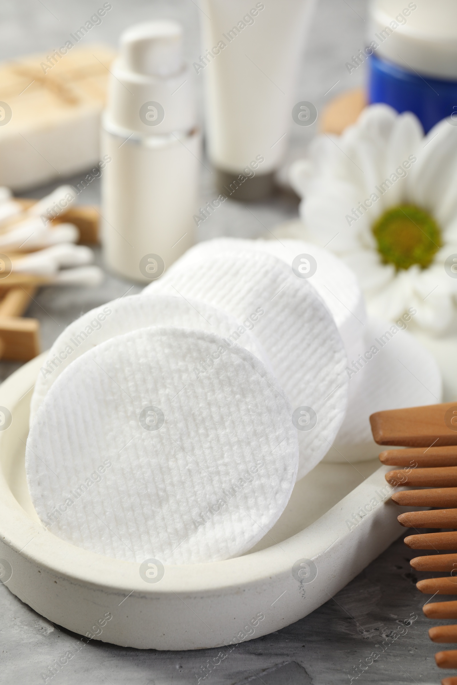 Photo of Clean cotton pads on grey table, closeup