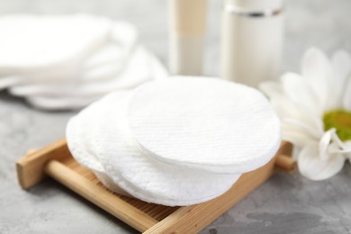 Photo of Clean cotton pads on grey table, closeup