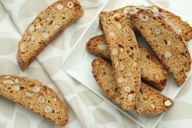 Traditional Italian almond biscuits (Cantucci) in bowl on table, top view