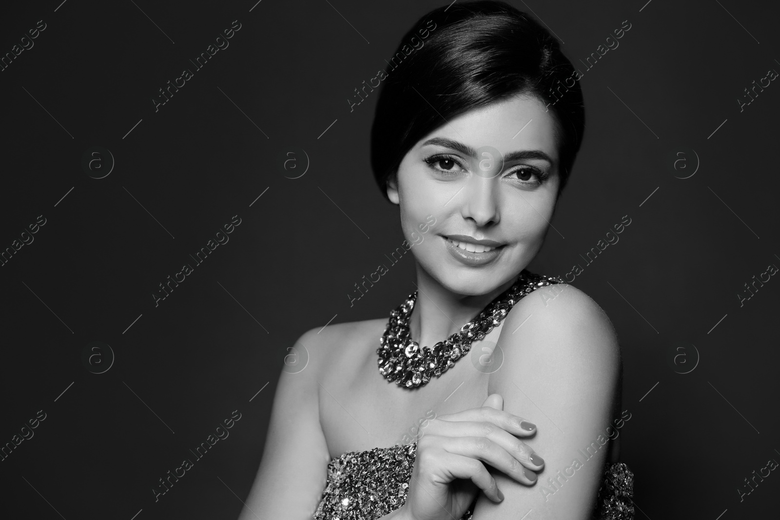 Image of Black-and-white portrait of beautiful young woman with luxury necklace