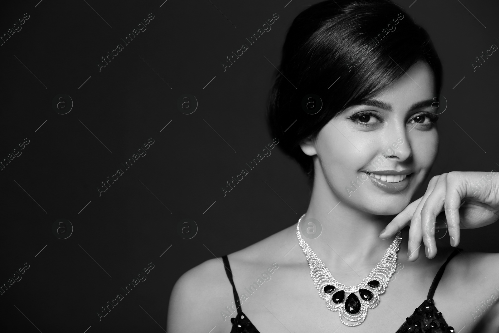 Image of Black-and-white portrait of beautiful young woman with luxury necklace