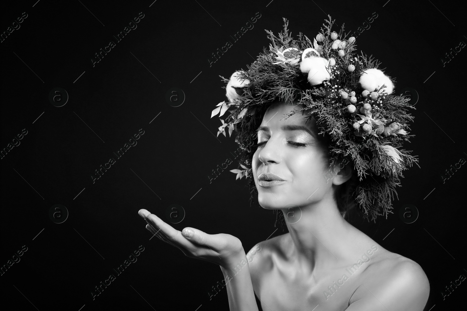 Image of Black-and-white portrait of beautiful young woman with floral wreath