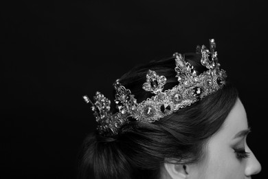 Image of Beautiful young woman with luxury crown, closeup. Black-and-white photo