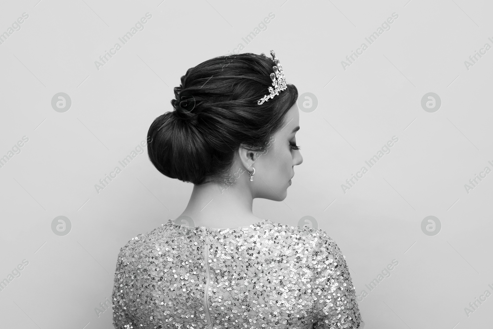 Image of Beautiful young woman with luxury crown. Black-and-white photo