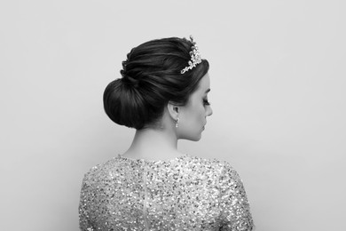 Image of Beautiful young woman with luxury crown. Black-and-white photo