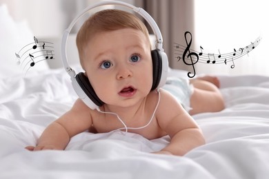 Cute little baby with headphones on bed at home. Music notes flying near child