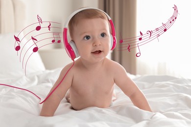 Cute little baby with headphones on bed at home. Music notes flying near child