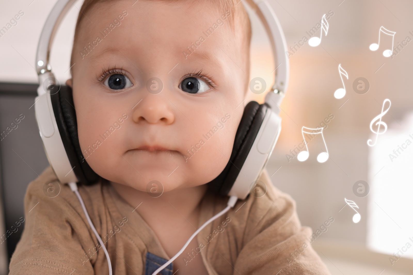 Image of Cute little baby with headphones at home. Music notes flying near child