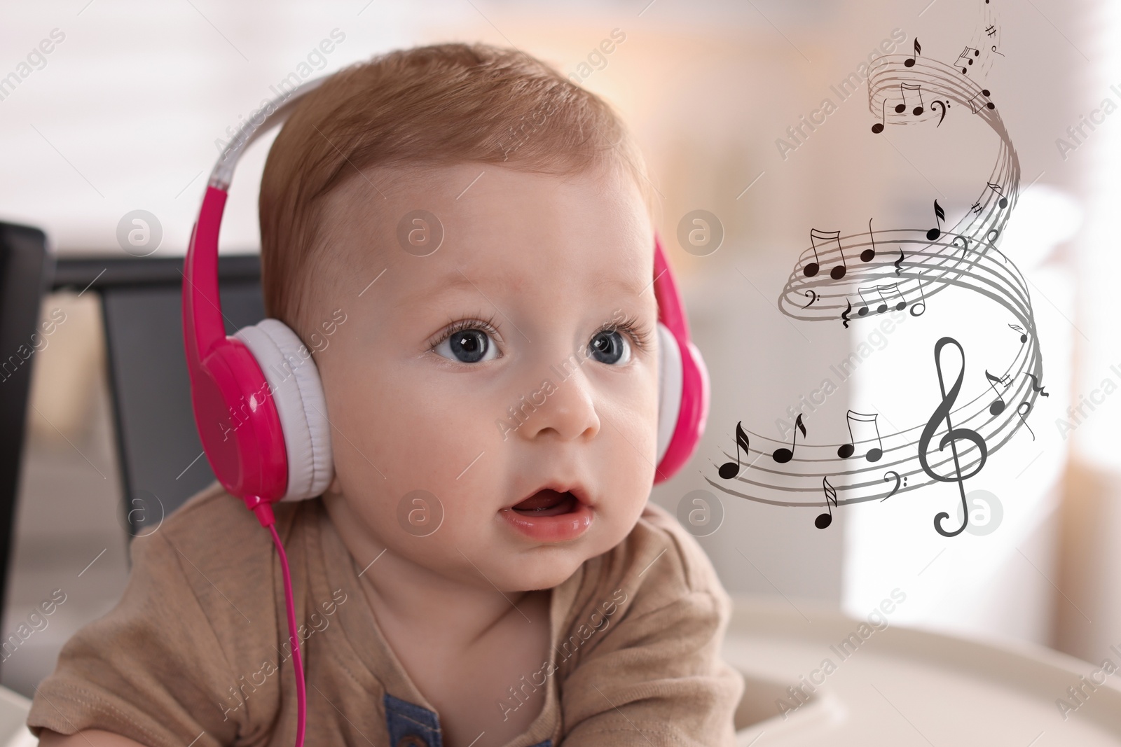 Image of Cute little baby with headphones on high chair at home. Music notes flying near child