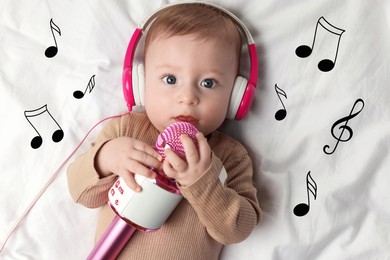 Image of Cute little baby with headphones and microphone lying on bed, top view. Music notes flying near child