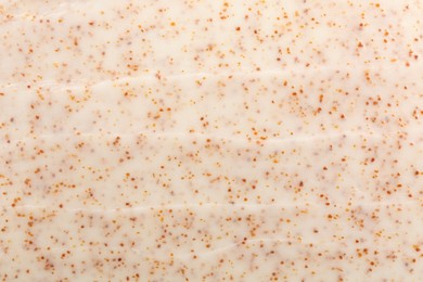 Photo of Sample of natural body scrub as background, closeup