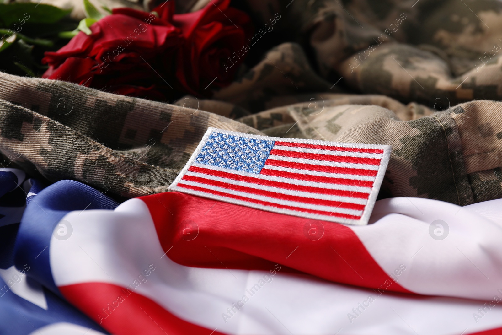 Photo of Veterans day. USA flag and army patch on military uniform, closeup