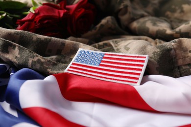 Photo of Veterans day. USA flag and army patch on military uniform, closeup