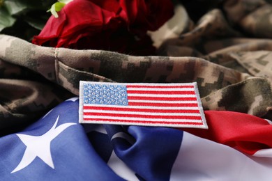 Photo of Veterans day. USA flag and army patch on military uniform, closeup