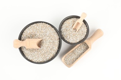 Photo of Rye bran in bowls isolated on white, top view