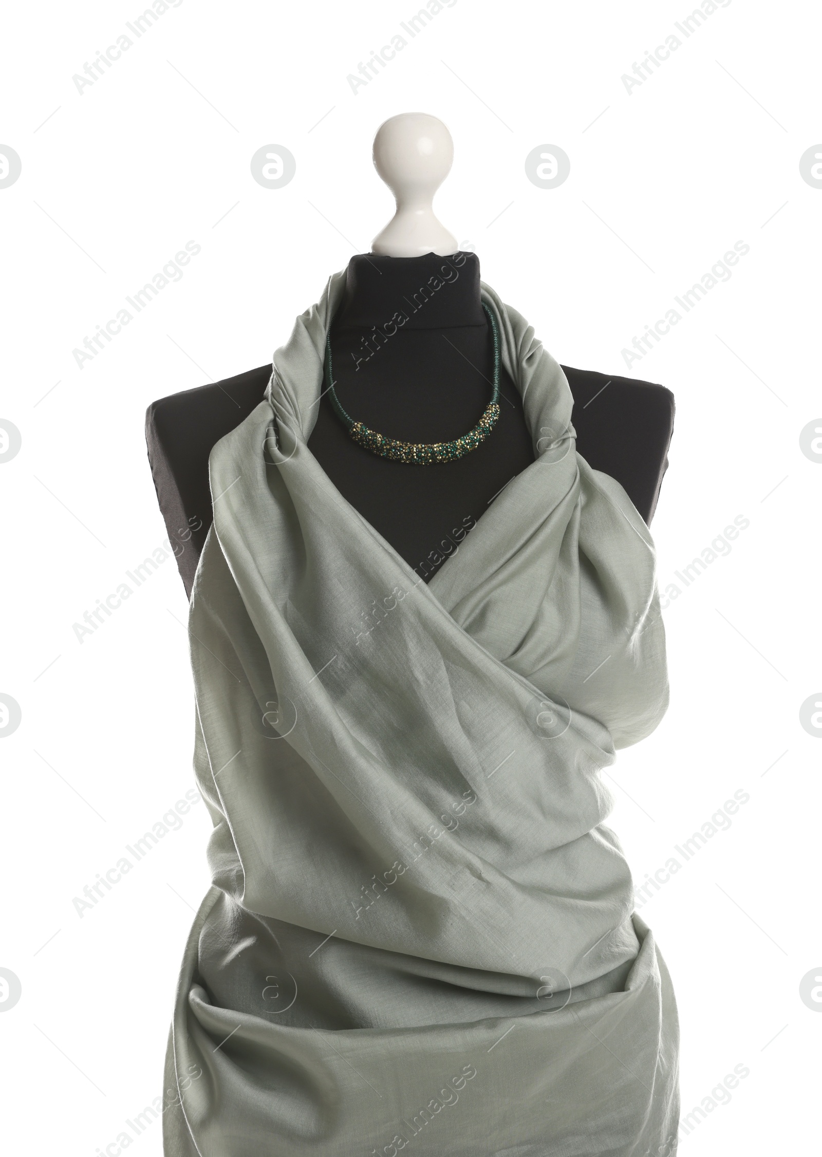 Photo of Draping grey fabric on female mannequin against white background