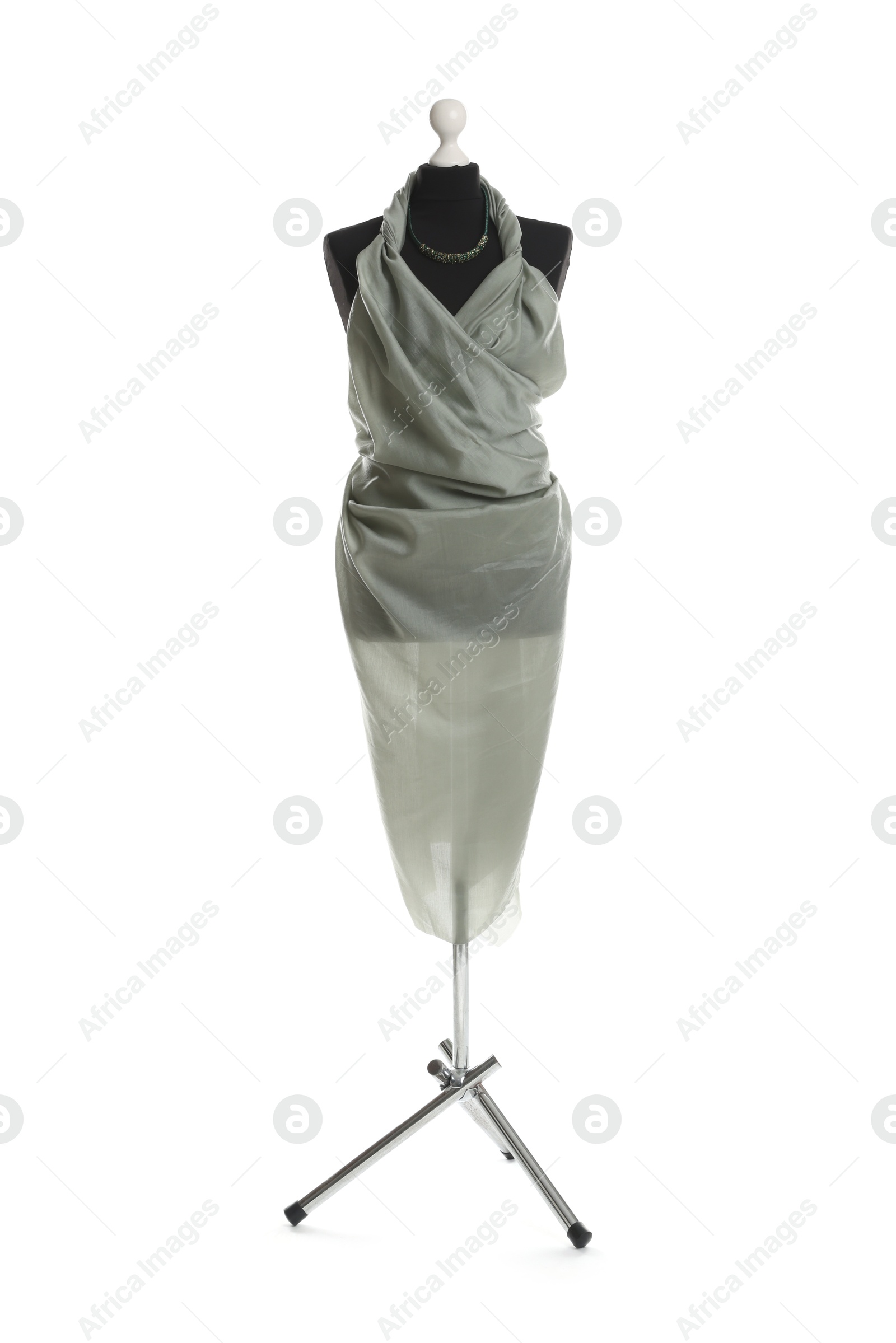 Photo of Draping grey fabric on female mannequin against white background