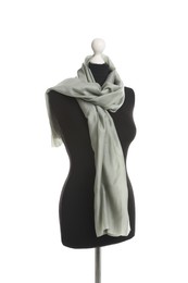 Draping grey fabric on female mannequin against white background