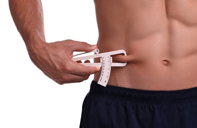 Photo of Man measuring body fat with caliper on white background, closeup