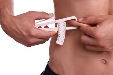 Photo of Man measuring body fat with caliper on white background, closeup