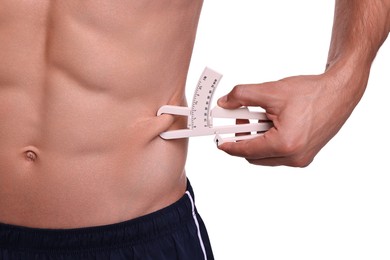 Photo of Man measuring body fat with caliper on white background, closeup