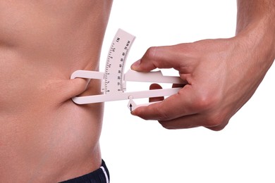 Photo of Man measuring body fat with caliper on white background, closeup