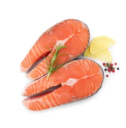 Photo of Steaks of fresh raw salmon and spices isolated on white, top view