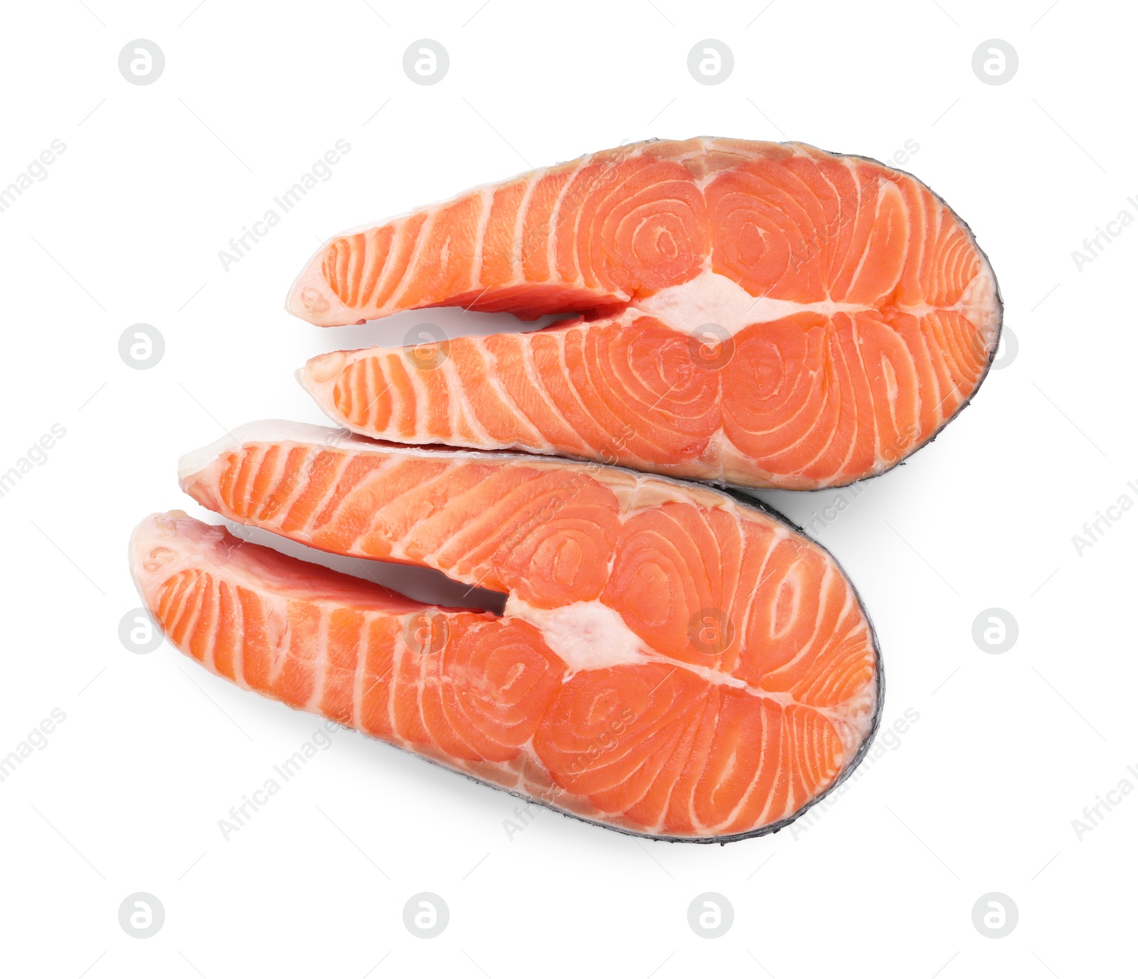 Photo of Steaks of fresh raw salmon isolated on white, top view