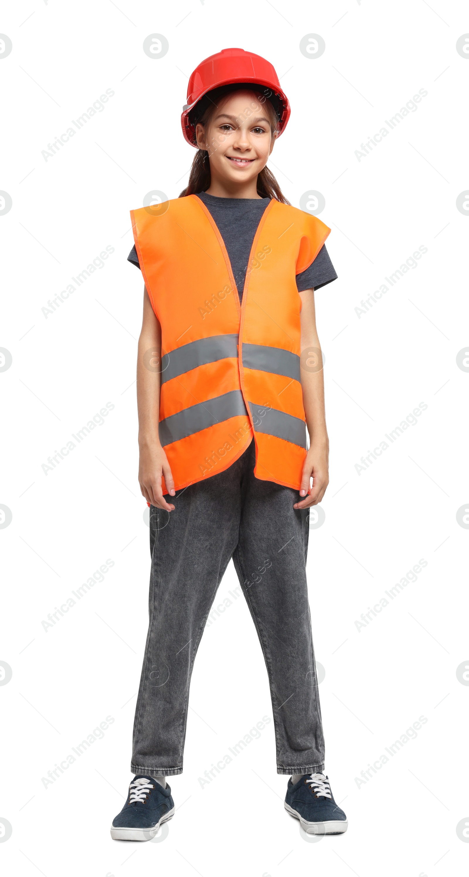 Photo of Girl with hardhat and vest pretending to be firefighter on white background. Dreaming of future profession