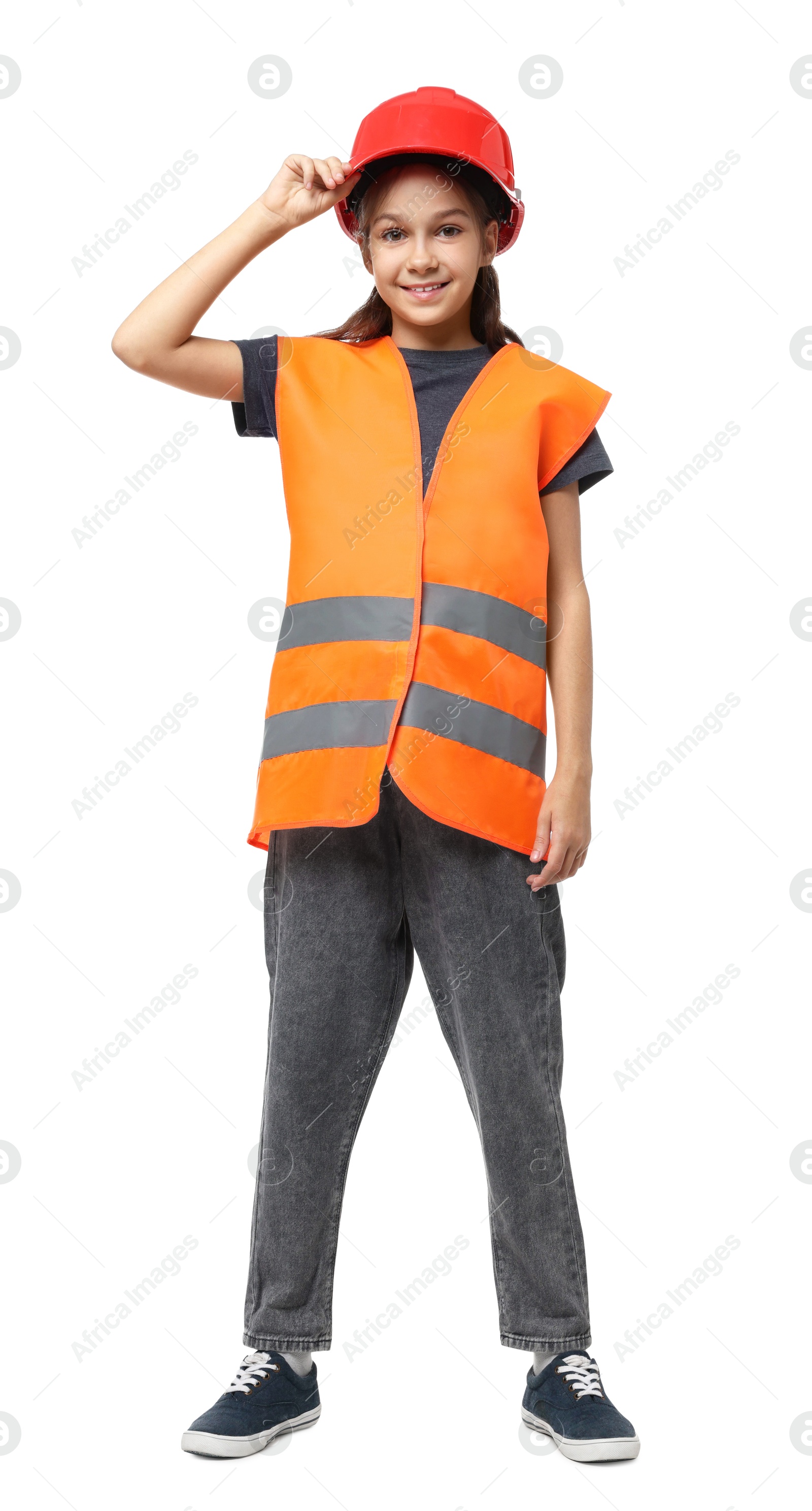 Photo of Girl with hardhat and vest pretending to be firefighter on white background. Dreaming of future profession