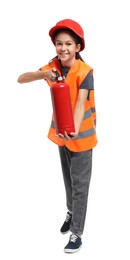 Photo of Girl with hardhat, fire extinguisher and vest pretending to be firefighter on white background. Dreaming of future profession