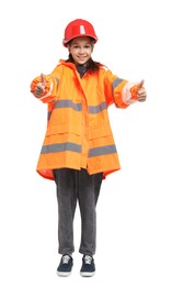 Girl with hardhat and vest pretending to be firefighter and showing thumbs up on white background. Dreaming of future profession