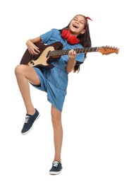 Photo of Girl with headphones and guitar pretending to be musician on white background. Dreaming of future profession