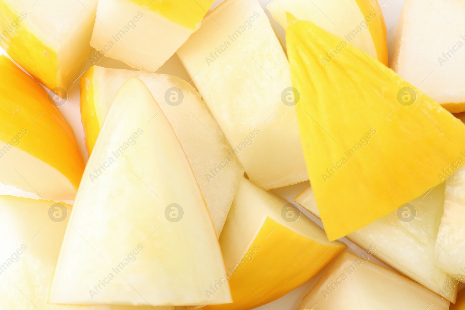 Photo of Pieces of fresh melon as background, top view