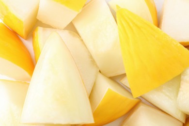 Photo of Pieces of fresh melon as background, top view