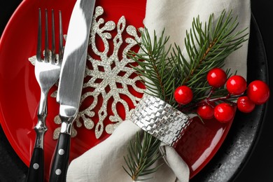 Photo of Christmas table setting with festive decor, top view