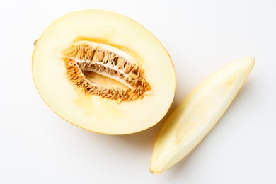 Photo of Fresh cut melon on white background, top view