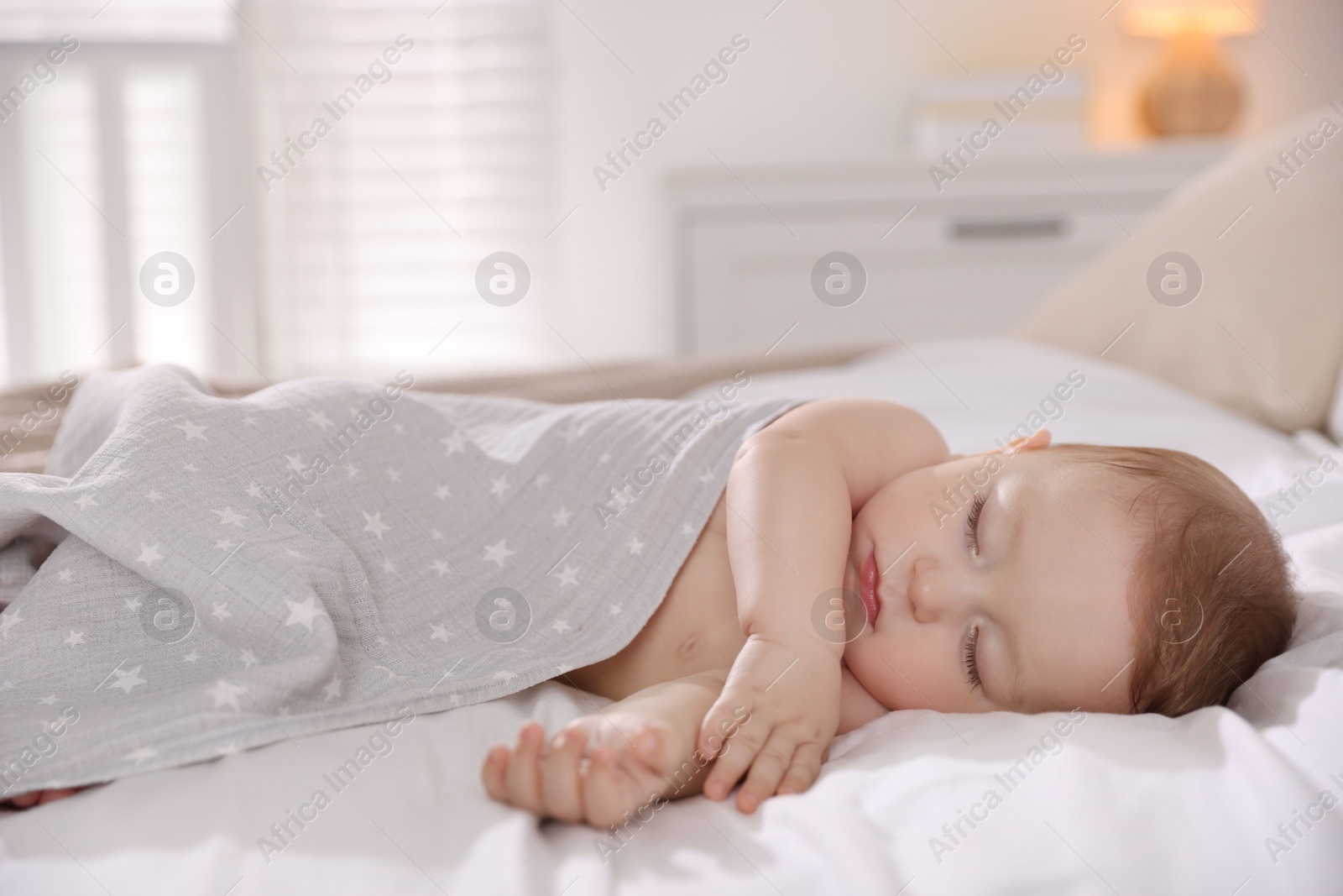 Photo of Cute little baby sleeping on bed at home