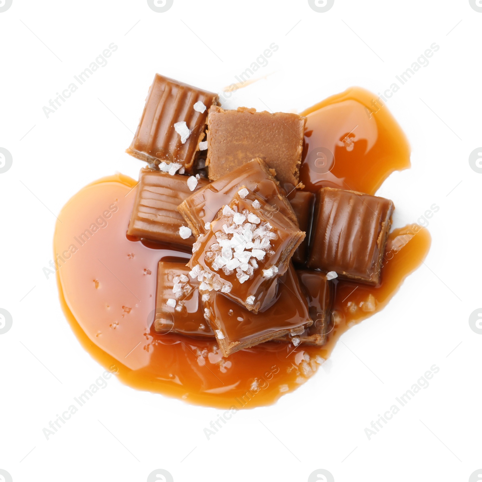 Photo of Tasty candies with salted caramel isolated on white, top view