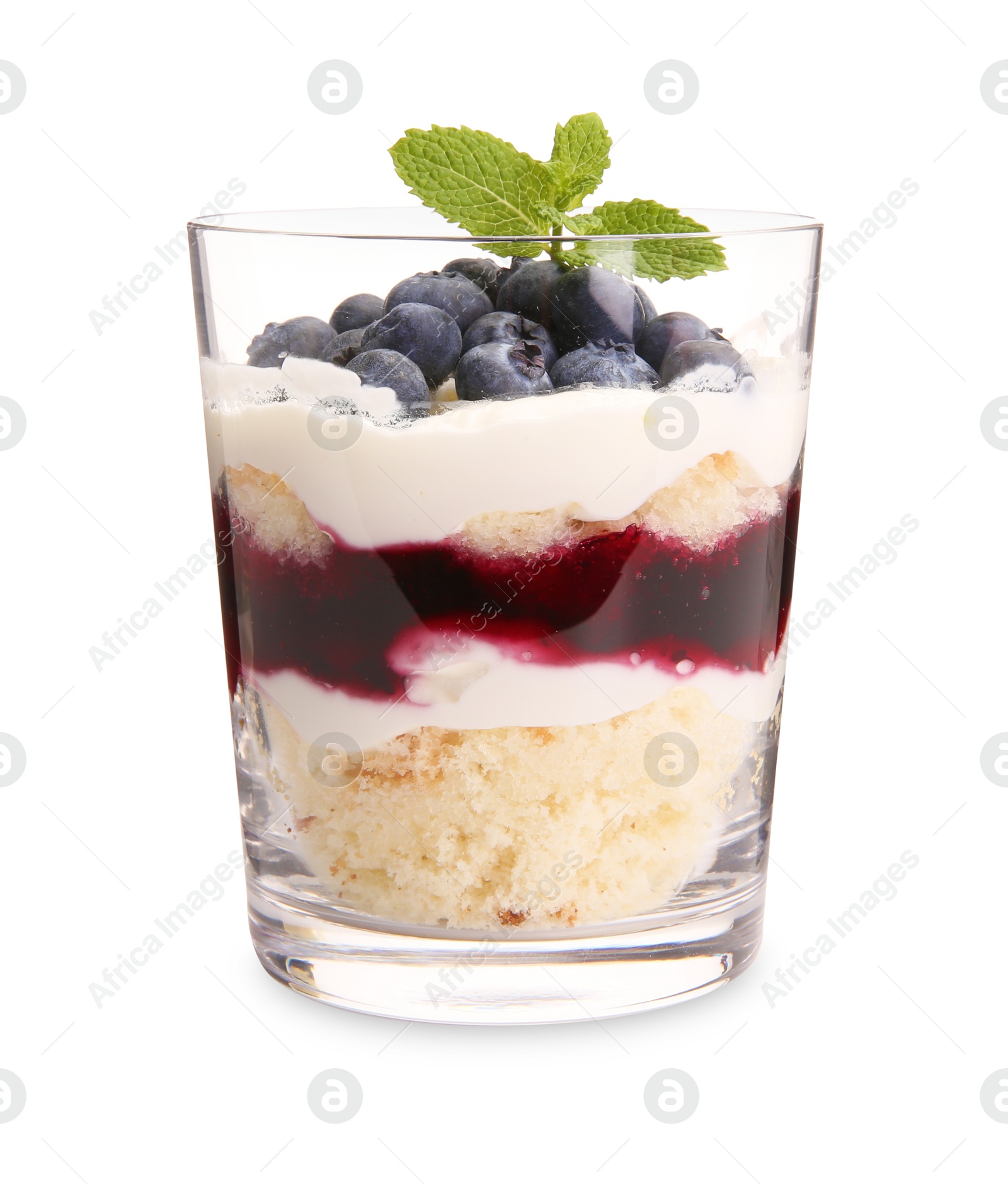 Photo of Tasty trifle dessert. Sponge cake, blueberries, jam and whipped cream in glass isolated on white